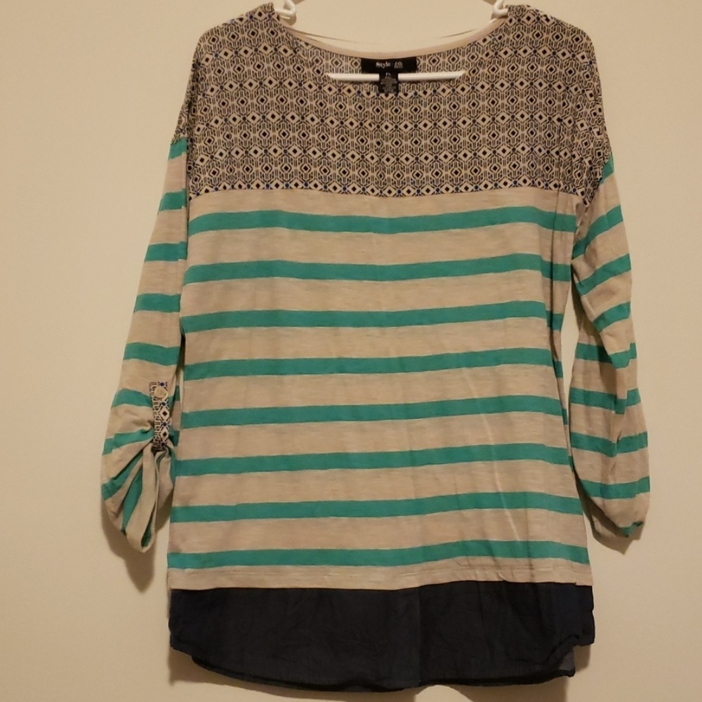 Three quarter length sleeve. Looks layered.